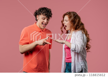 Positive funny couple playing rock paper scissors. Rochambeau team games. Settling dispute method, decision 118815812