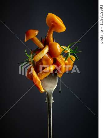 Pickled honey mushrooms garnished with rosemary. Pickled honey mushrooms garnished with rosemary. 118815993