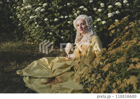 Portrait of blonde woman dressed in historical Baroque clothes with old fashion hairstyle 118816680
