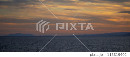 Colorful sunset over spanish coastline. Seascape with sun rays in the evening. 118819402