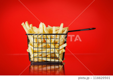 French fries on a red background 118820501