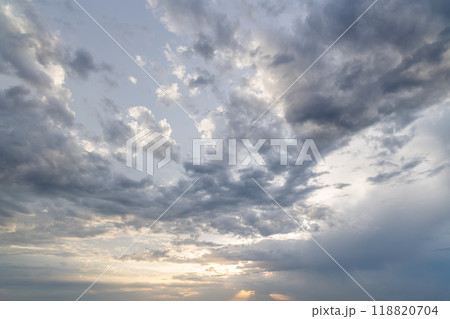 A dramatic and moody sky filled with dark, swirling clouds A dramatic and moody sky filled with dark, swirling clouds 118820704