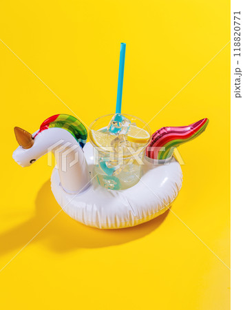 A vibrant summer vacation scene with floating flamingo and cocktail 118820771