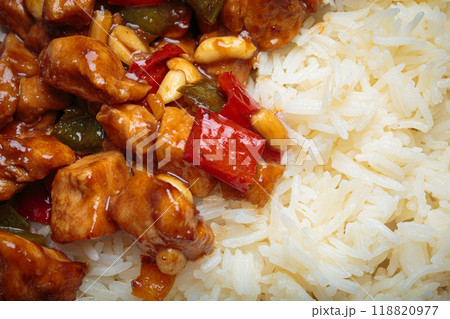 Close up of Kung pao chicken with peanuts and rice on a plate top view, traditional Chinese cuisine 118820977