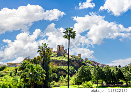 Views from the Parque de la Retama of the castle of Alcala de Guadaira in Seville, in blue sky and white clouds Views from the Parque de la Retama of the castle of Alcala de Guadaira in Seville, in blue sky and white clouds 118822183