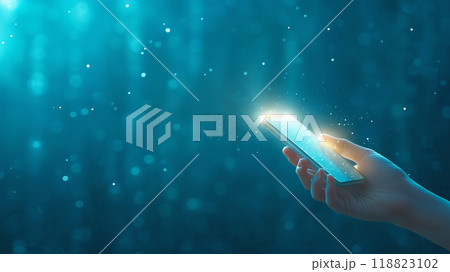 Hand holding a glowing smartphone in a dark, mystical setting 118823102