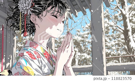和服を着て初詣をしている若い女性