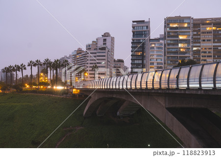 Bridge over a river with a Lima city in the background. Miraflores, Lima Peru. Bridge over a river with a Lima city in the background. Miraflores, Lima Peru. 118823913