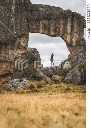 Woman in rock megalithic, Huayllay Stone Forest, Peru. 118823920