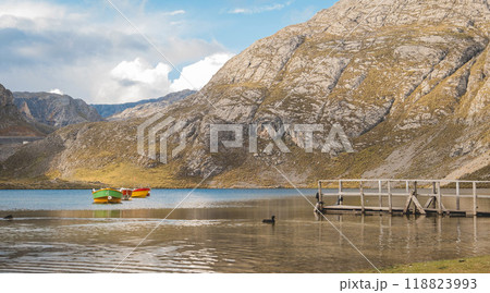 A lake with a dock and a few boats in lagoon seven colors, Road to the Mountain range of the Viuda, Canta. Peru. 118823993