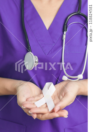 Stop Violence Against Women and November Lung Cancer Awareness month. Doctor with White ribbon in hospital. Healthcare and World Cancer day concept Stop Violence Against Women and November Lung Cancer Awareness month. Doctor with White ribbon in hospital. Healthcare and World Cancer day concept 118824581