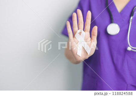 Stop Violence Against Women and November Lung Cancer Awareness month. Doctor with White ribbon in hospital. Healthcare and World Cancer day concept Stop Violence Against Women and November Lung Cancer Awareness month. Doctor with White ribbon in hospital. Healthcare and World Cancer day concept 118824588