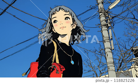 冬枯れの街を歩く若い女性