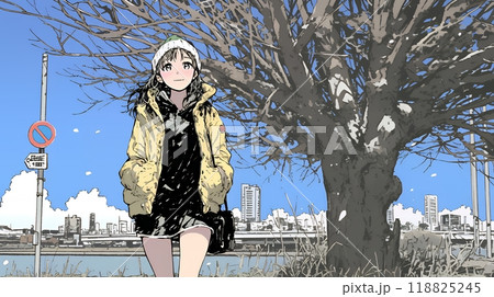 冬枯れの街を歩く若い女性