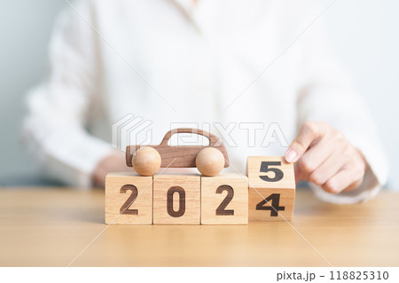 2024 end year to Happy New Year 2025 with Car model on table. Automobile Tax, Car Insurance, Financial, vehicle Repair and Maintenance and New Year concept 118825310