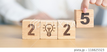 2025 block with lightbulb. Business Idea, Creative, Thinking, brainstorm, Goal, Resolution, strategy, plan, Action, change and New Year start concepts 118825323