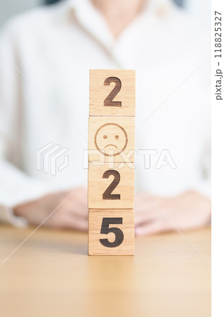 Happy New Year 2025 with Sad face block. Satisfaction, feedback, Review, mental health, eco sustainable and bad year concept Happy New Year 2025 with Sad face block. Satisfaction, feedback, Review, mental health, eco sustainable and bad year concept 118825327