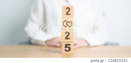 2025 block with jigsaw puzzle icon. Business Process, Team, teamwork, Goal, mission, Resolution, strategy, plan, Action, partnership, and New Year start 118825331