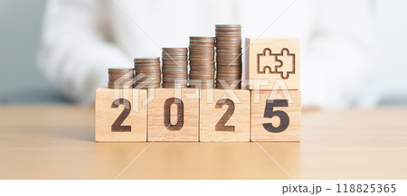 Happy New Year 2025 with Coins stack and jigsaw puzzle icon. business Process, Team, teamwork, Strategy, goal, Money, Budget, investment, financial and New Year Resolution concept 118825365