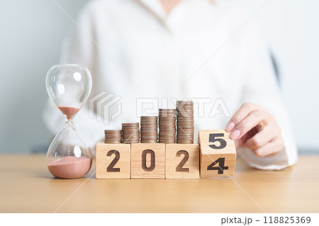 2024 end year to Happy New Year 2025 with hourglass and coins stack arrangement. Money Saving for Future Plan, Retirement fund, Pension, Investment, Wealth Business, Financial and countdown concepts 2024 end year to Happy New Year 2025 with hourglass and coins stack arrangement. Money Saving for Future Plan, Retirement fund, Pension, Investment, Wealth Business, Financial and countdown concepts 118825369