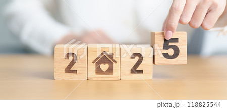 Happy New Year 2025 with Home and Heart block. Property investment, House Mortgage, Real Estate tax, homeless, donation, Financial and happy family concepts Happy New Year 2025 with Home and Heart block. Property investment, House Mortgage, Real Estate tax, homeless, donation, Financial and happy family concepts 118825544