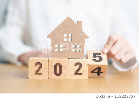 2024 end year to Happy New Year 2025 with house model. real estate, Home loan and mortgage, tax, investment, financial, savings and New Year Resolution concepts 2024 end year to Happy New Year 2025 with house model. real estate, Home loan and mortgage, tax, investment, financial, savings and New Year Resolution concepts 118825557