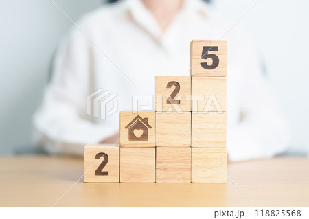 Happy New Year 2025 with Home and Heart block. Property investment, House Mortgage, Real Estate tax, homeless, donation, Financial and happy family concepts 118825568