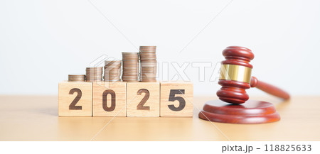 Happy New Year 2025 with judge gavel and money coins stack on desk. Law cost, lawyer, judgment, justice auction and bidding concepts 118825633