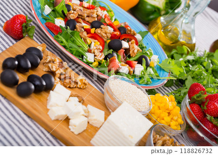 Ingredients for salad from arugula and vegetables 118826732