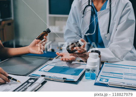 international team of professional doctors having a meeting in conference room at the modern hospital. Healthcare and medical development concept. international team of professional doctors having a meeting in conference room at the modern hospital. Healthcare and medical development concept. 118827079