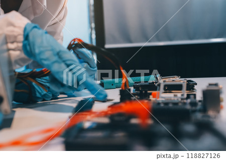 Electronics technician, electronic engineering electronic repair, electronics measuring and testing, repair and maintenance concepts. Electronics technician, electronic engineering electronic repair, electronics measuring and testing, repair and maintenance concepts. 118827126