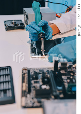 Electronics technician, electronic engineering electronic repair, electronics measuring and testing, repair and maintenance concepts. Electronics technician, electronic engineering electronic repair, electronics measuring and testing, repair and maintenance concepts. 118827144