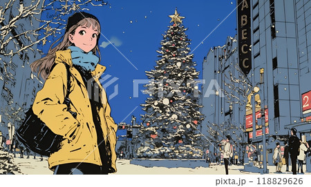 クリスマスイルミネーションが美しい街を散策する若い女性