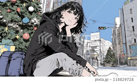 ホワイトクリスマスの街を歩く若い女性