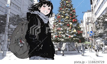 ホワイトクリスマスの街を歩く若い女性