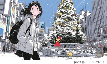 ホワイトクリスマスの街を歩く若い女性