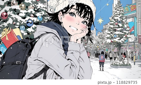 ホワイトクリスマスの街を歩く若い女性