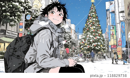 ホワイトクリスマスの街を歩く若い女性