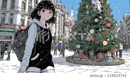 ホワイトクリスマスの街を歩く若い女性
