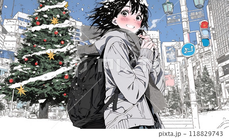 ホワイトクリスマスの街を歩く若い女性