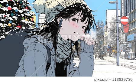 ホワイトクリスマスの街を歩く若い女性