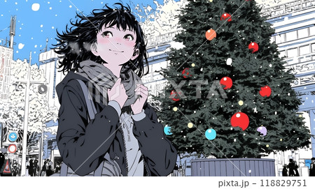 ホワイトクリスマスの街を歩く若い女性