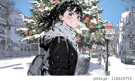 ホワイトクリスマスの街を歩く若い女性