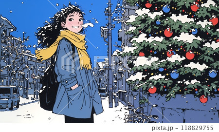 ホワイトクリスマスの街を歩く若い女性