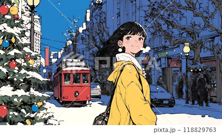 ホワイトクリスマスの街を歩く若い女性