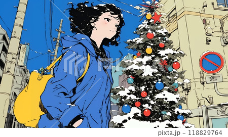 ホワイトクリスマスの街を歩く若い女性