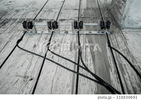Cables in an elevator shaft at a new building construction site 118830691