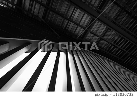 A structure featuring wooden slats on construction site contributing to its architectural style 118830732