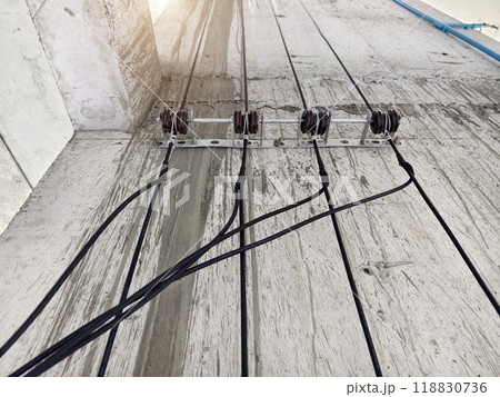 Cables in an elevator shaft at a new building construction site 118830736