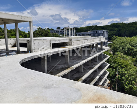 Large building with a roof pool of water under construction Large building with a roof pool of water under construction 118830738